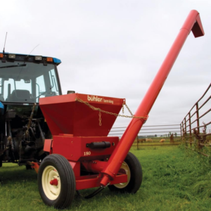moulages, rouleuse. Équipement agricole pour la manutention de grain attaché à un tracteur